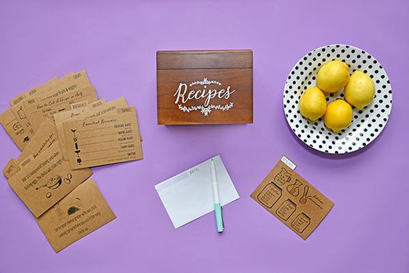 Dark wood farmhouse recipe box and kraft recipe card dividers on purple background 