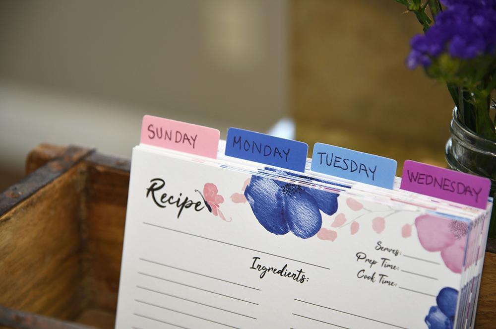 Pink and blue watercolor floral recipe cards labeled with days of the week in rustic farmhouse recipe box